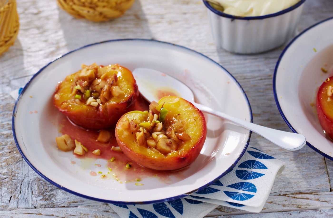 Baked caramelised peaches with salted nuts