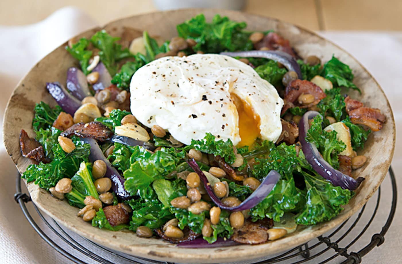 Warm kale, bacon and lentil salad with poached egg