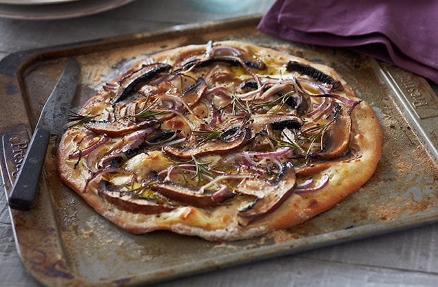 BBQ pizzas with mushrooms and red onion