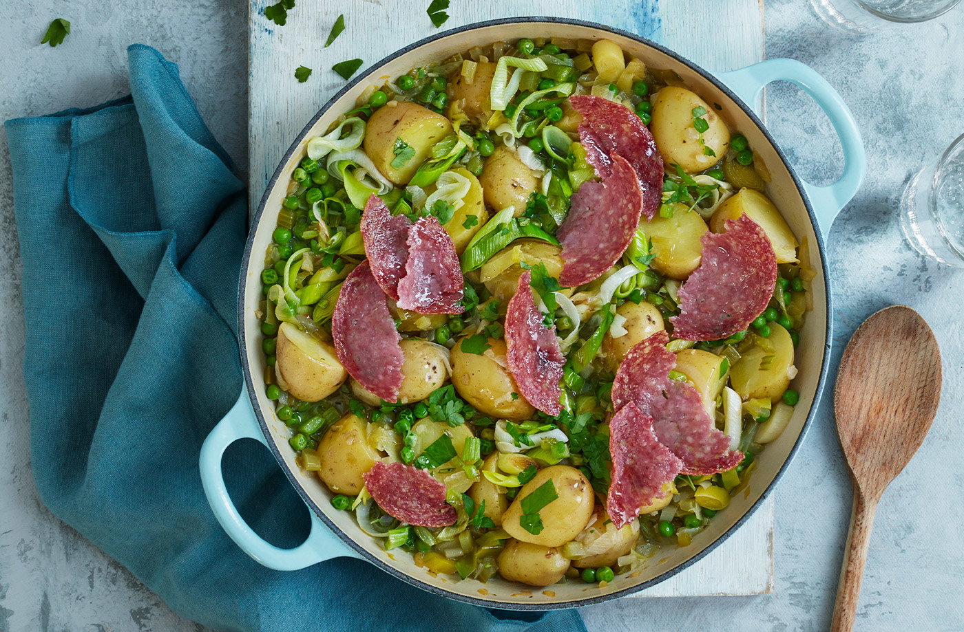 Pea and potato stew with crispy salami
