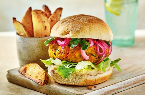 Image of "Spiced red lentil burgers with potato wedges"