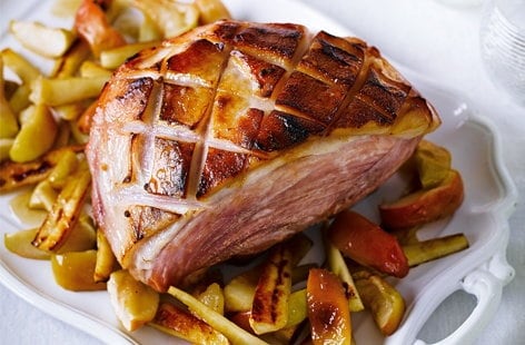 Image of "Calvados and honey glazed ham with baked apples and parsnips"