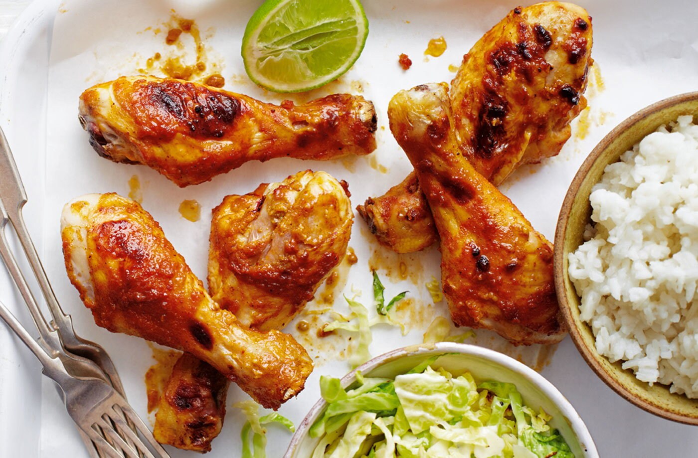 Peanut chicken drumsticks with rice and cabbage