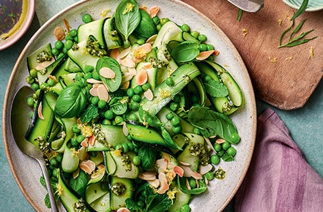 Marinated courgette ribbons with peas and mint