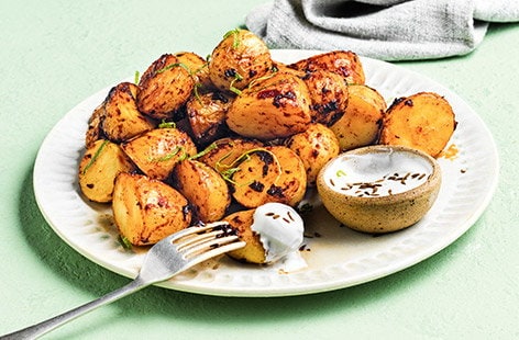 Image of "Chipotle-roasted baby potatoes with yogurt dip"