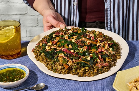 Image of "Seema’s braised lentils with rainbow chard and charred lemon gremolata"