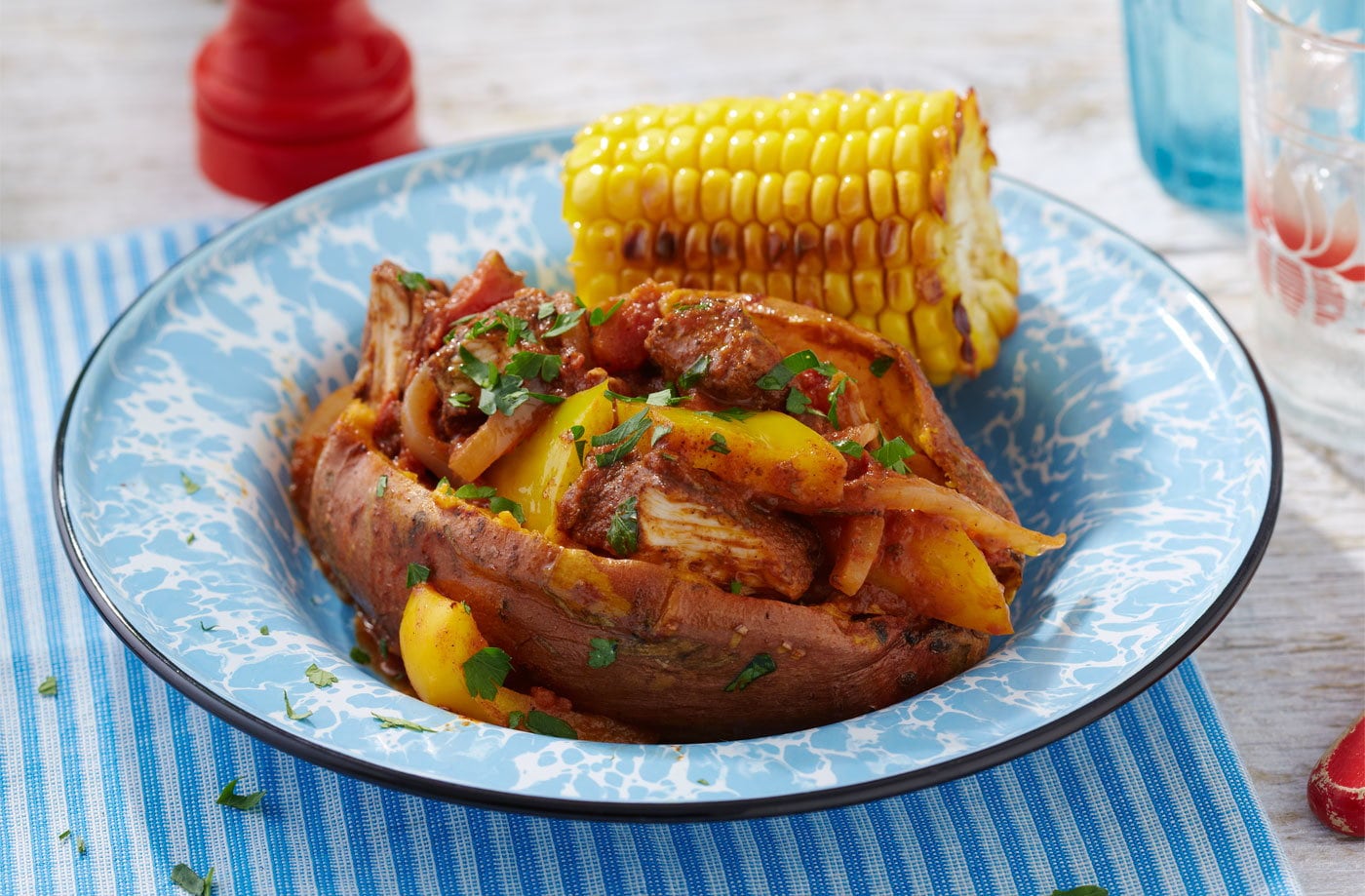 Jerk chicken stew with campfire corn on the cob