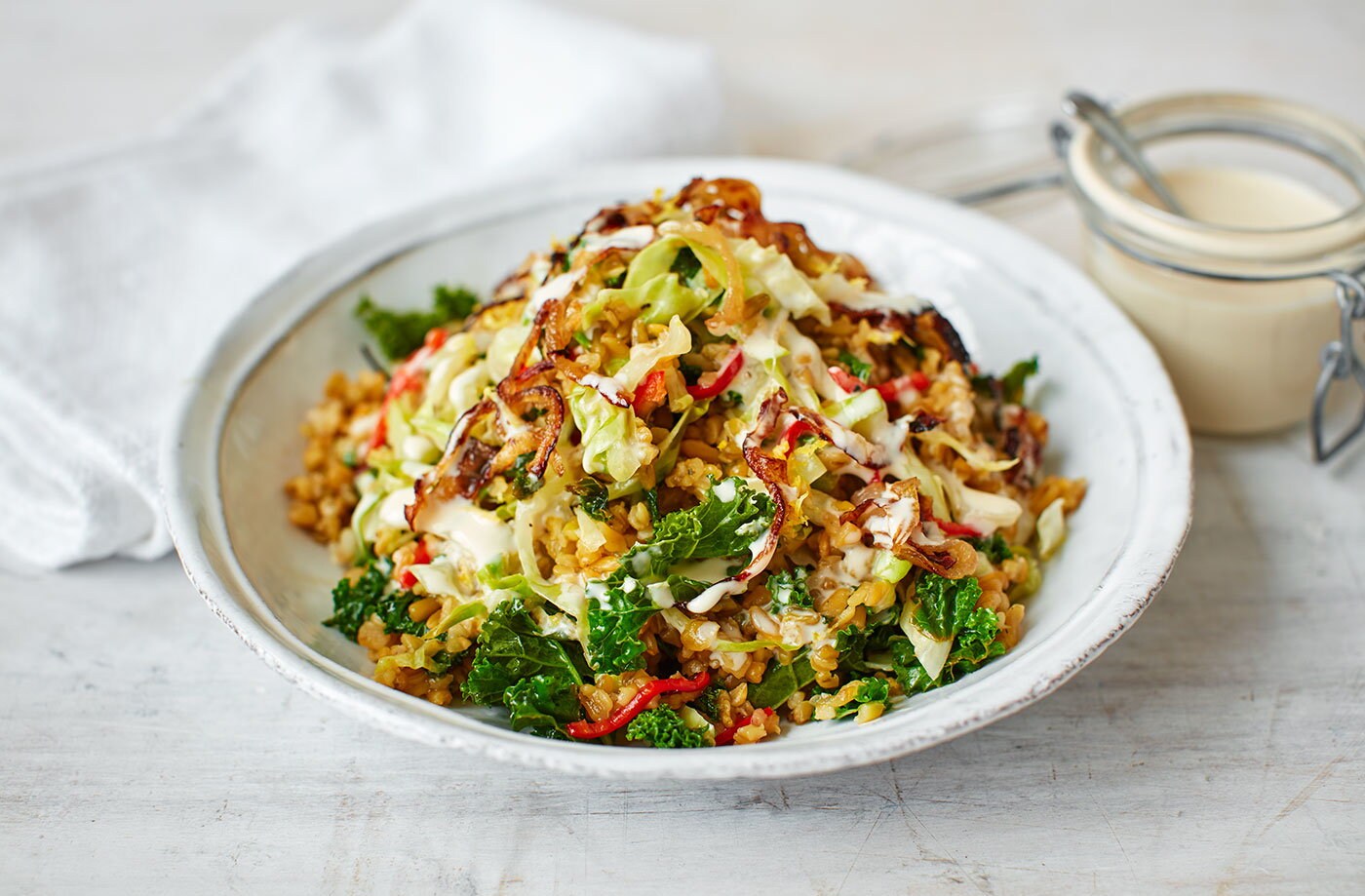 Grains, stir-fried greens and tahini dressing