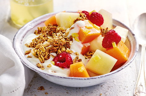 Image of "Ginger-lemon melon and raspberry breakfast bowl"