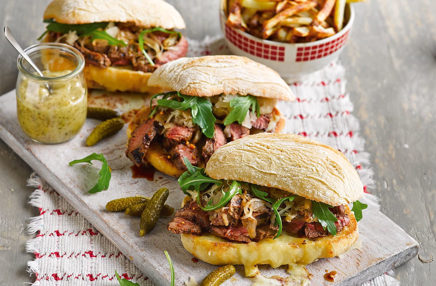 Reuben steak sandwich with skin-on fries