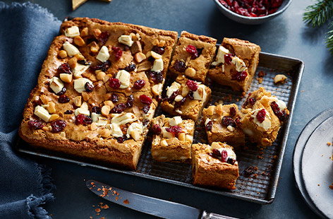 Image of "Brown butter, cranberry and macadamia blondies"