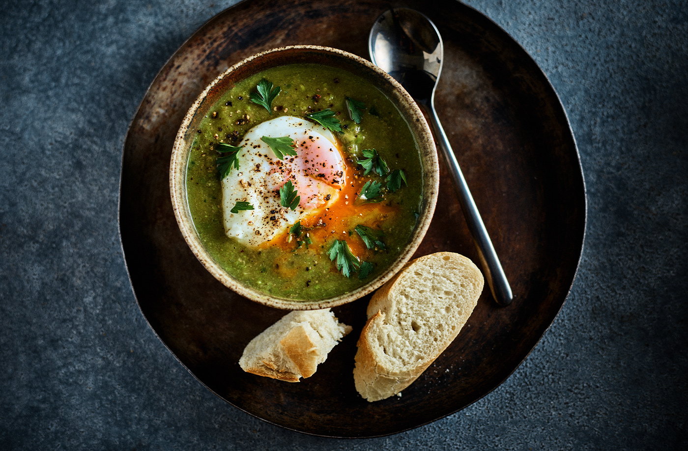 Pea and ham soup with poached eggs