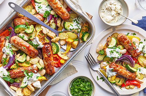 Image of "Greek-style sausage and butter bean traybake"