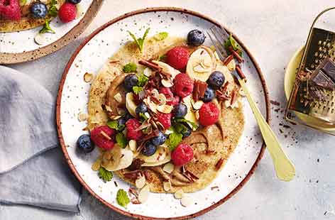 Image of "Almond, berry and banana breakfast tacos"