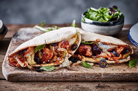 Image of "Sausage meatball-melt loaded pittas"