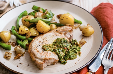 Image of "Pork steaks with mojo sauce and Cuban potatoes"