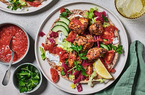 Chicken kebabs with homemade chilli sauce and flatbreads