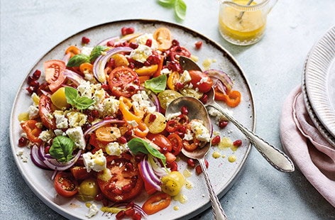 Image of "Tomato, onion, pepper and pomegranate salad"