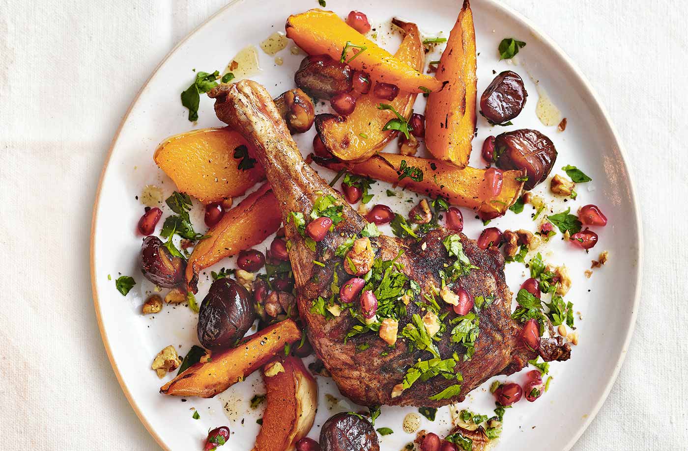 Five-spice duck legs with squash and pomegranate