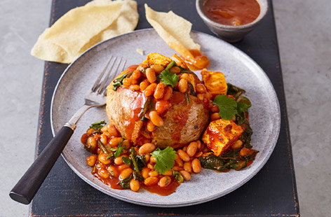 Image of "Jacket potatoes with curried beans and paneer"
