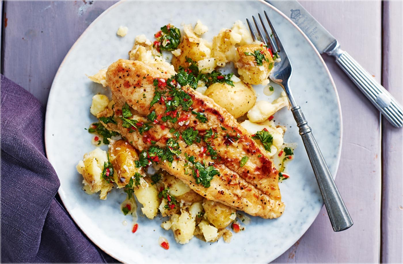 Pan-fried basa fillets with garlic potatoes