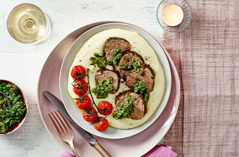 Image of "Aligot with roast pork and tarragon salsa verde"