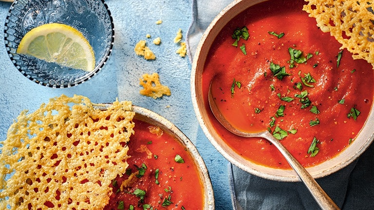 Tomato soup with cheesy topper