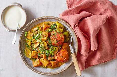 Image of "Leek, pea and sweet potato curry with dumplings"