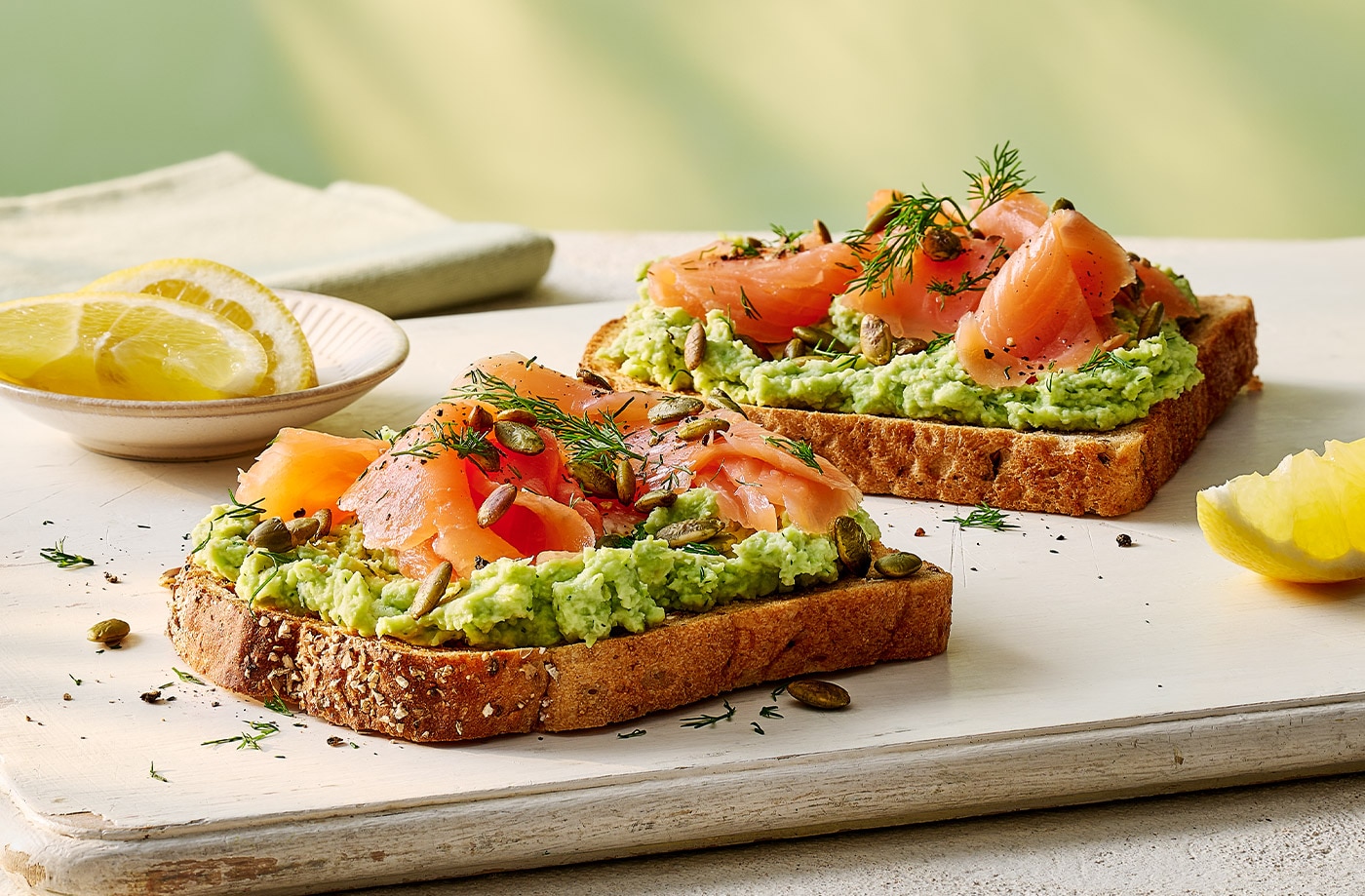 Smashed soya beans and salmon on toast