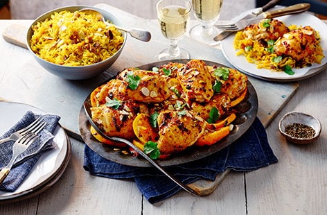 Image of "Harissa and orange chicken thighs with spiced rice"