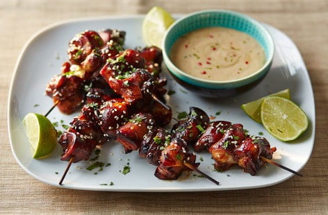 Image of "Sticky teriyaki chicken bites with peanut dip"