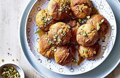 Image of "Vegan doughnut balls with tahini and maple drizzle"