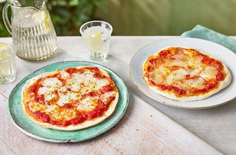 Image of "3-ingredient tomato and mozzarella easy pizzas"