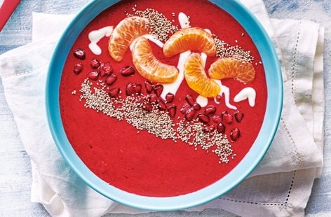 Image of "Raspberry smoothie bowl with pomegranate and clementine"