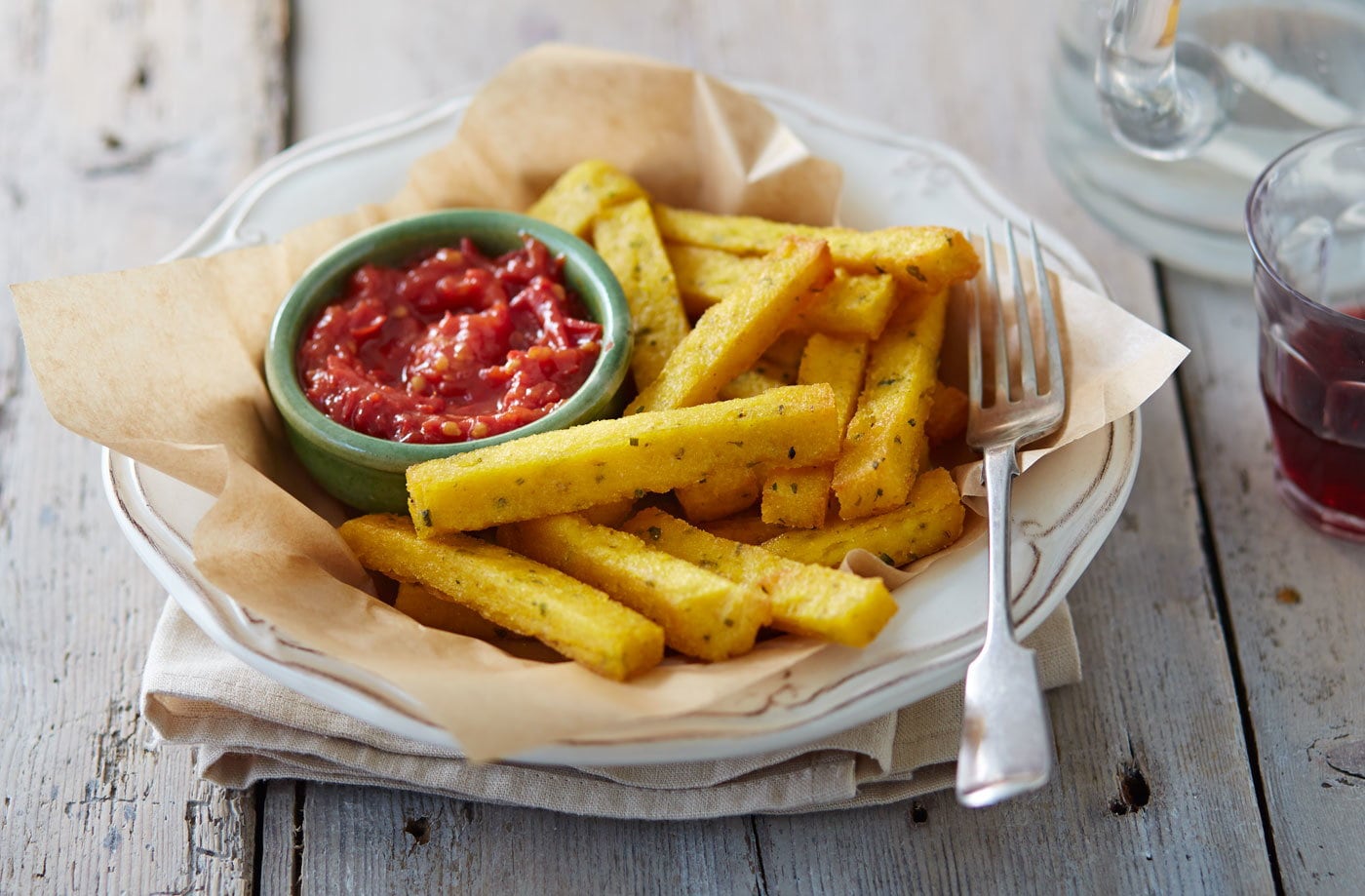 Polenta chips with Parmesan, herbs and a chilli-tomato relish