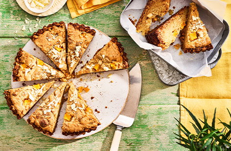 Image of "White chocolate and mango flapjack blondie tart"