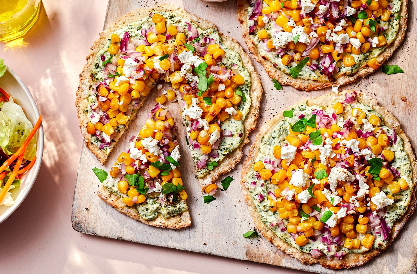 Cauliflower pizzettes with sweetcorn and feta