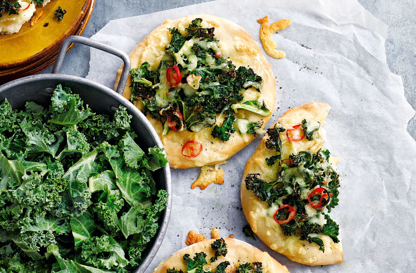 Mini kale, gouda and chilli pizzas