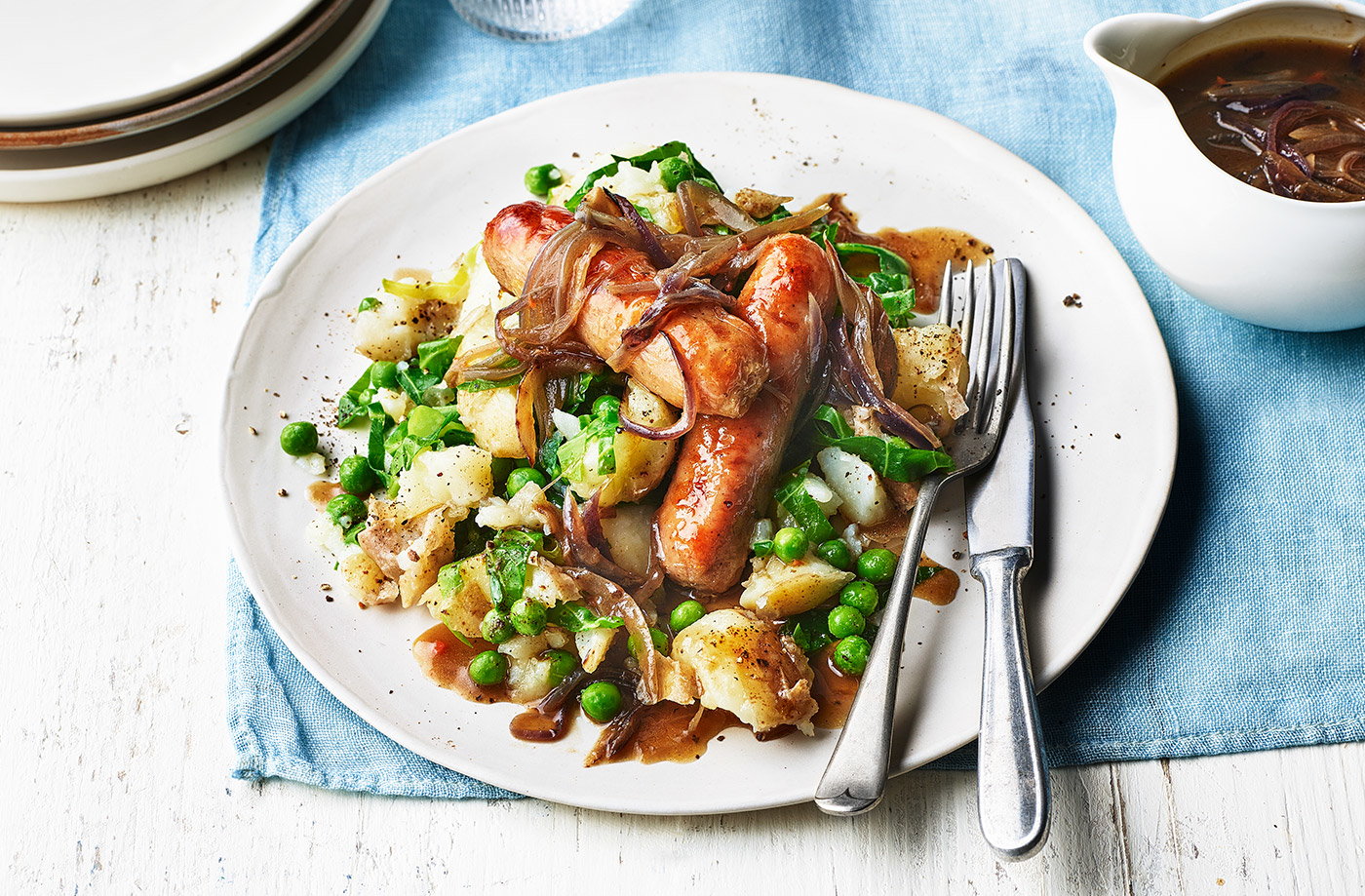 Bangers and smashed spring potatoes