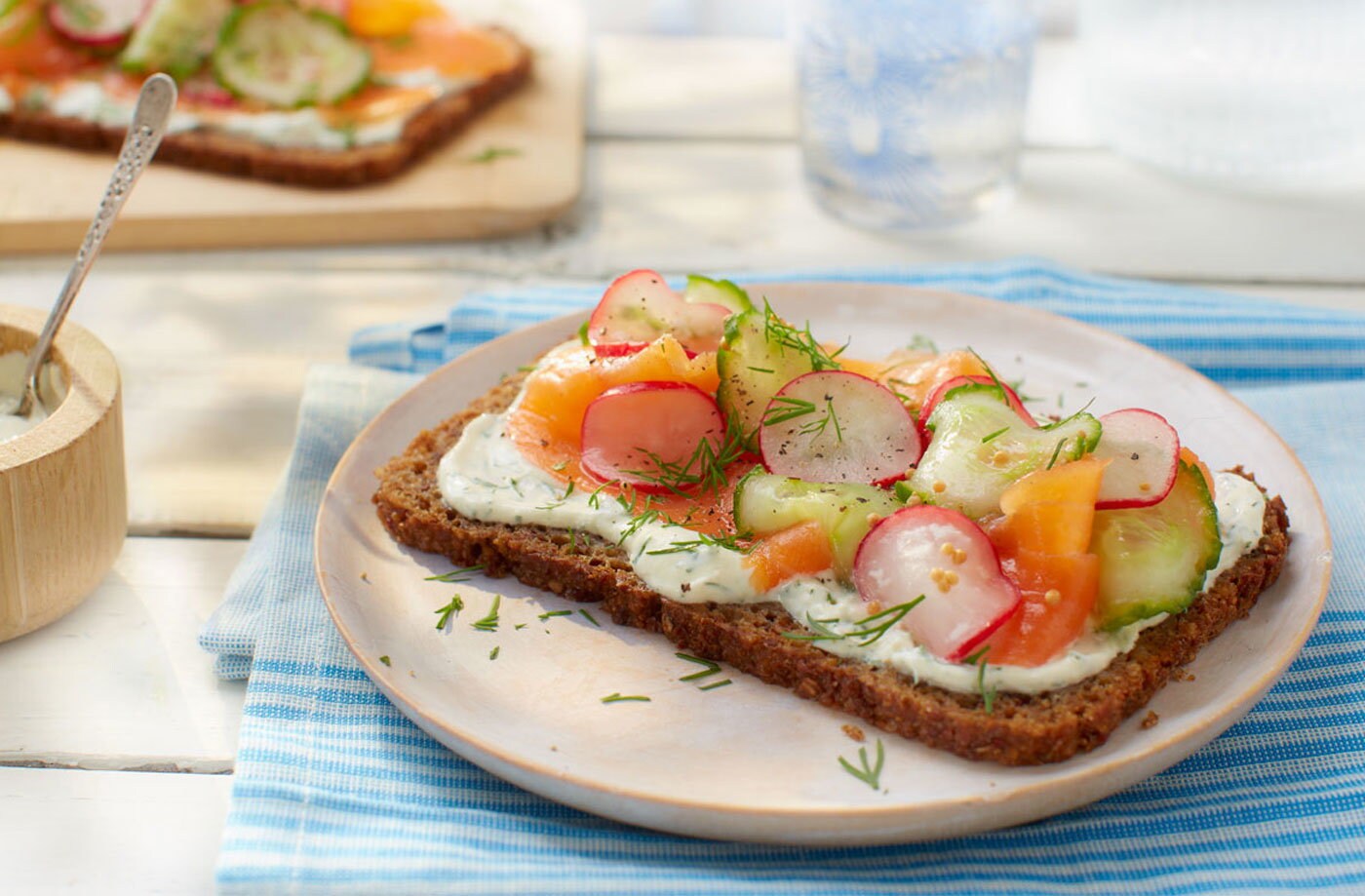 Smoked salmon and rye bread with pickled radishes and cucumber