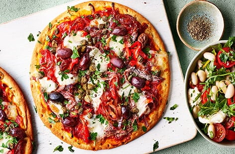 Image of "Red pepper and anchovy pizzas"
