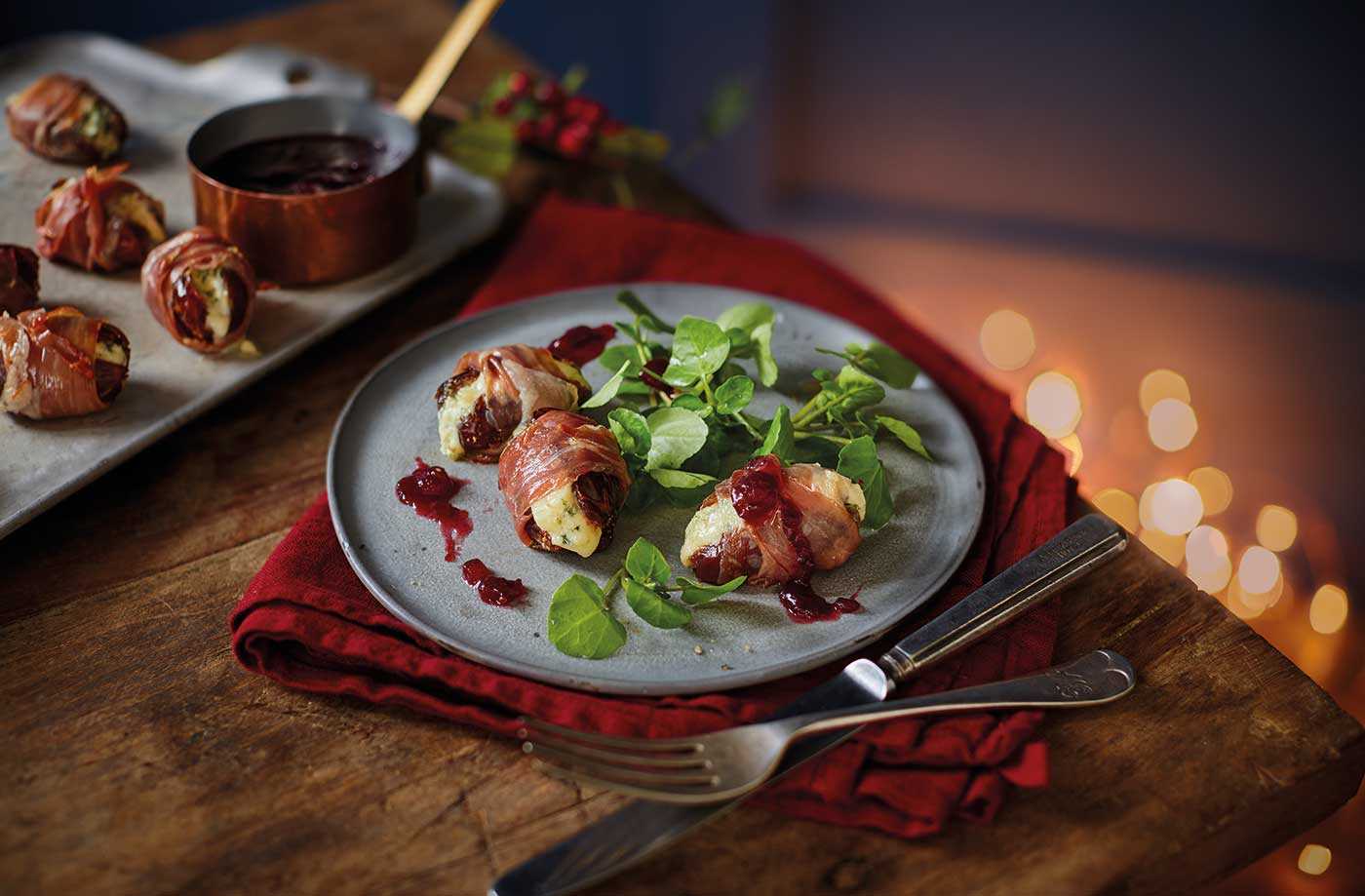 Prosciutto wrapped dates with port and cranberry sauce