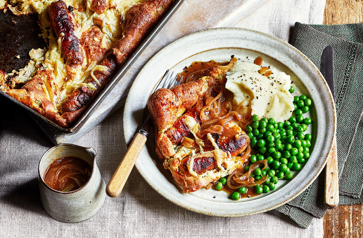 Cheese and onion toad-in-the-hole with mash, peas and gravy