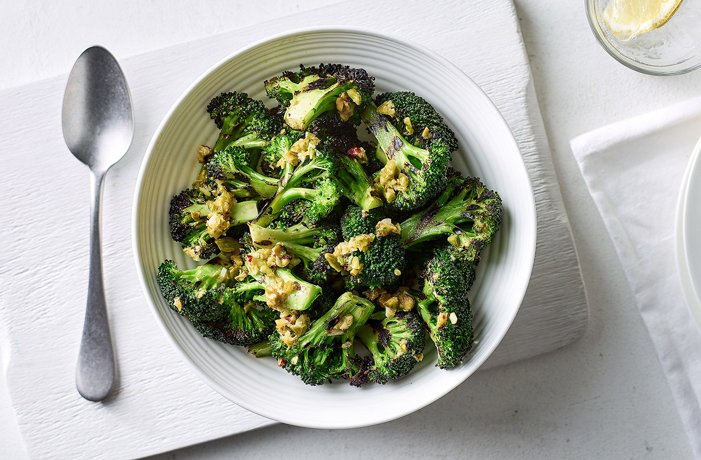 Griddled broccoli with pistachio nuts, lemon and olive oil
