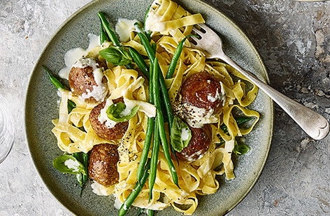 Image of "Veggie ‘meatballs’ with creamy tagliatelle and green beans"