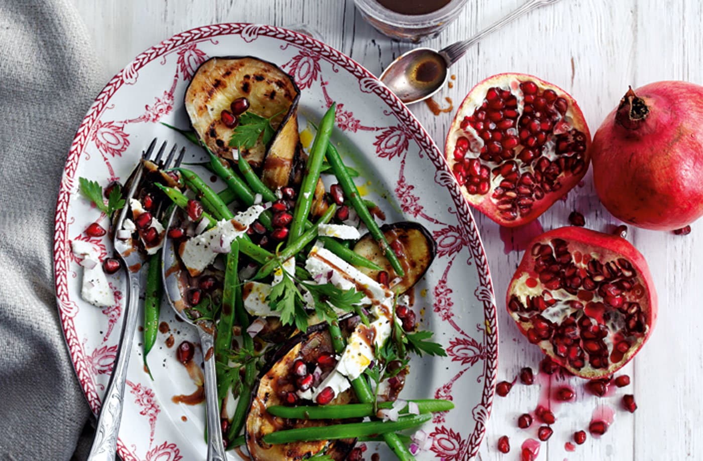 Grilled aubergines with green beans, feta and pomegranate seeds