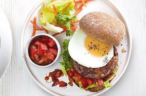 Image of "Egg-topped veggie bean burgers"
