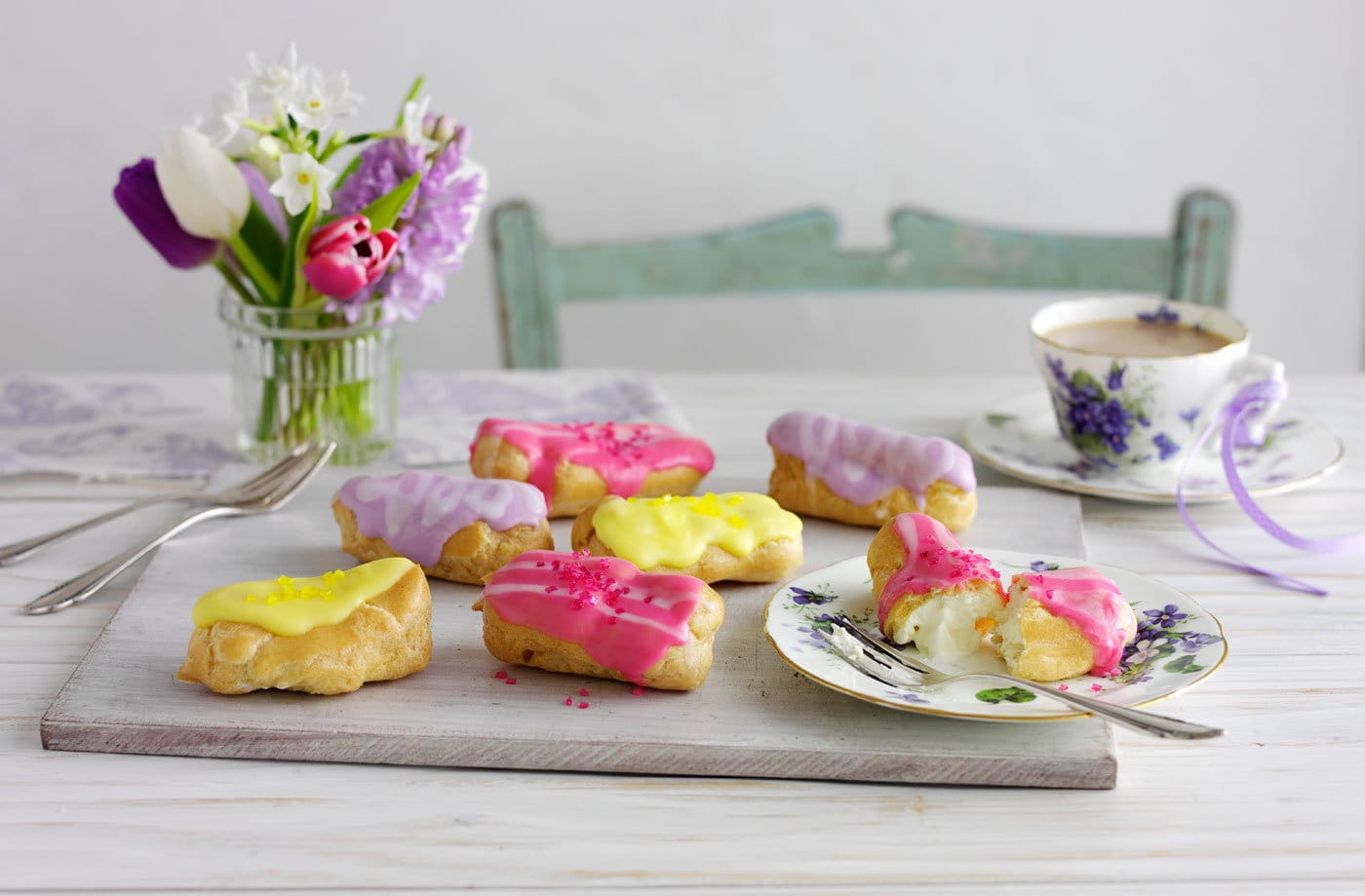 Mini eclairs with coloured icing