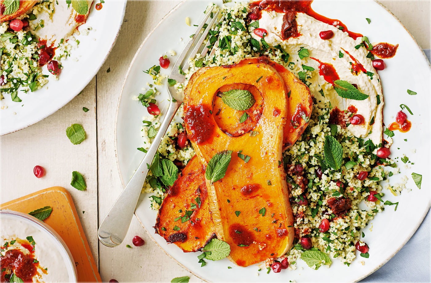 Butternut squash steaks with houmous and jewelled couscous
