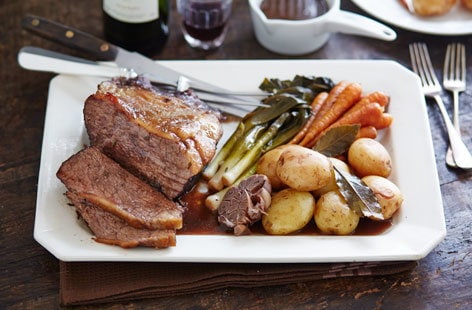 Image of "Pot-roasted beef in red wine with baby veg and new potatoes"